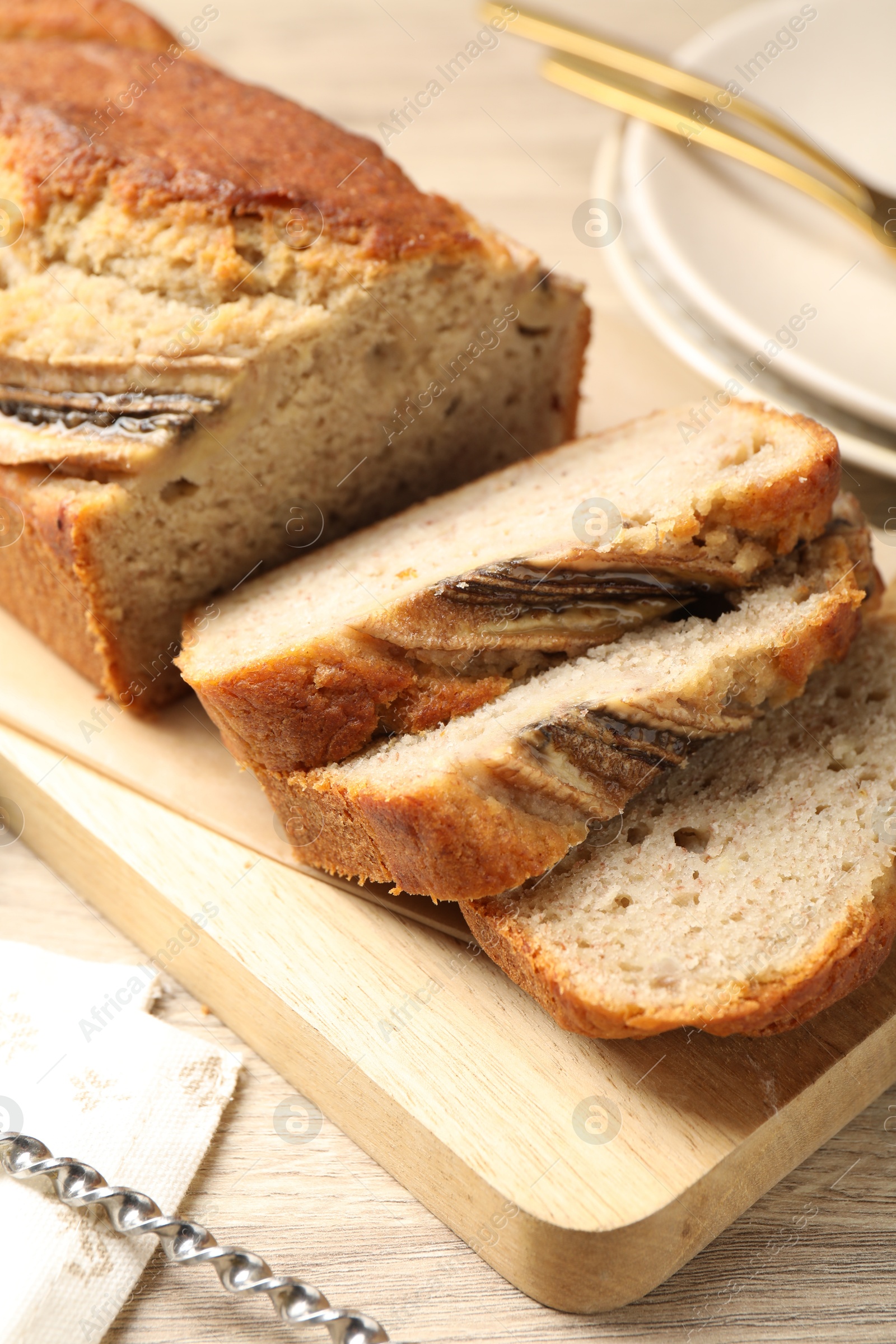 Pieces of banana bread on wooden table, closeup Photo of Pieces of banana bread on wooden table, closeup