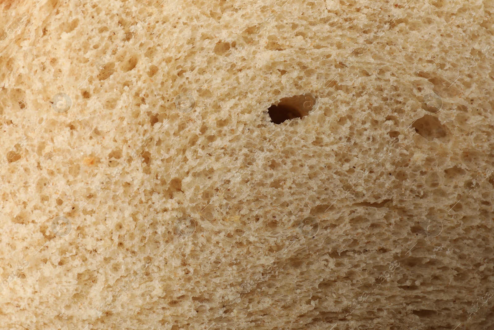 Freshly baked bread as background, closeup view Photo of Freshly baked bread as background, closeup view