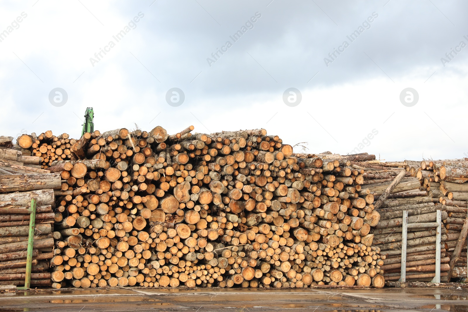 Stacked firewood outdoors. Heating house in winter Photo of Stacked firewood outdoors. Heating house in winter