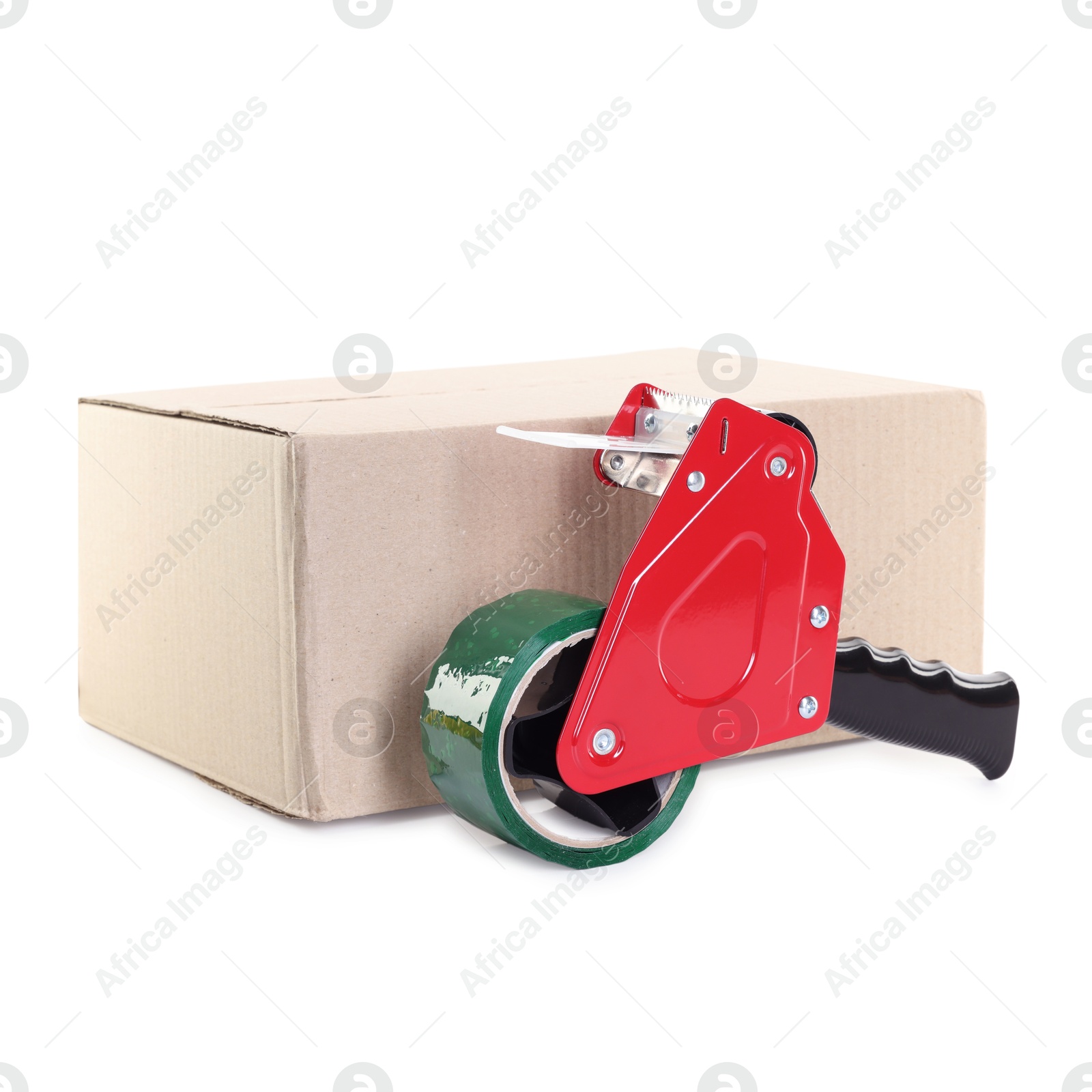 Photo of Dispenser with adhesive tape on cardboard box against white background