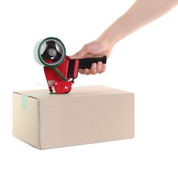 Photo of Man using dispenser with adhesive tape to seal cardboard box on white background, closeup
