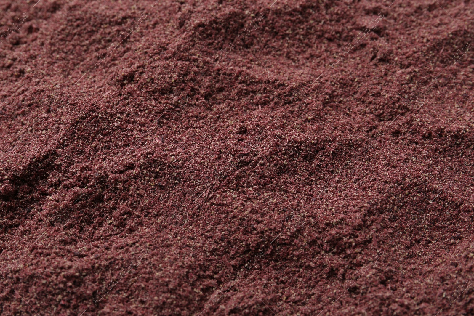 Superfood. Black currant powder as background, above view Photo of Superfood. Black currant powder as background, above view