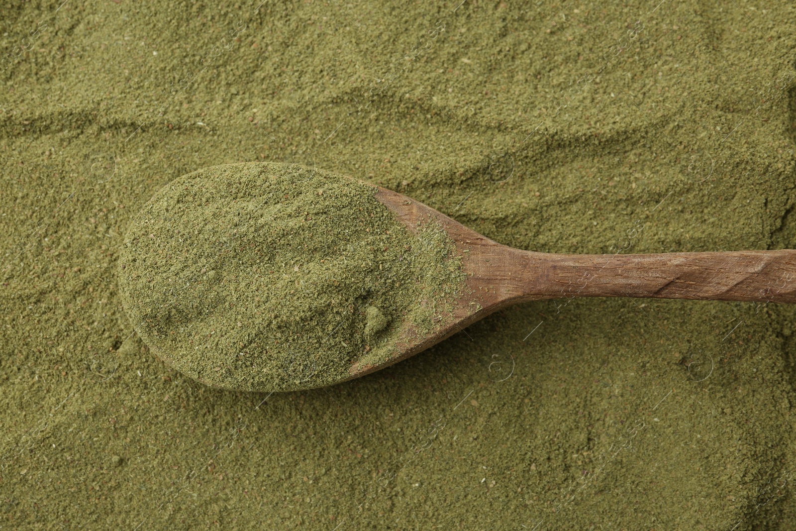 Superfood. Green onion powder and spoon, top view Photo of Superfood. Green onion powder and spoon, top view