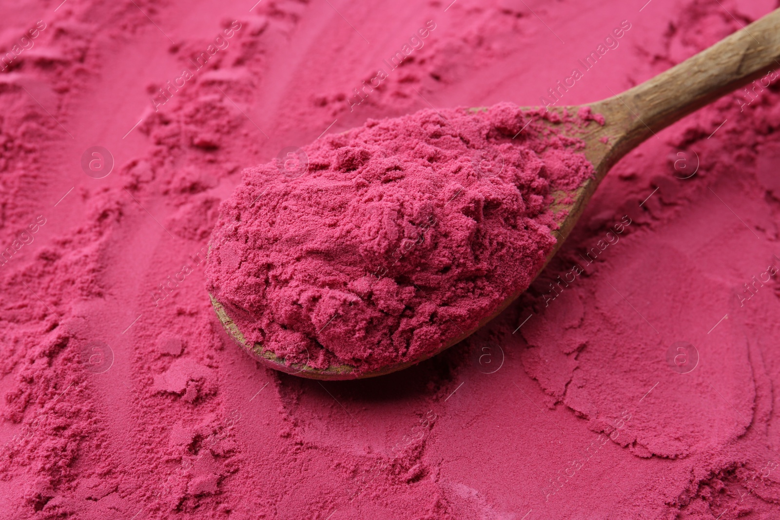 Superfood supplement. Acai powder and spoon, closeup Photo of Superfood supplement. Acai powder and spoon, closeup