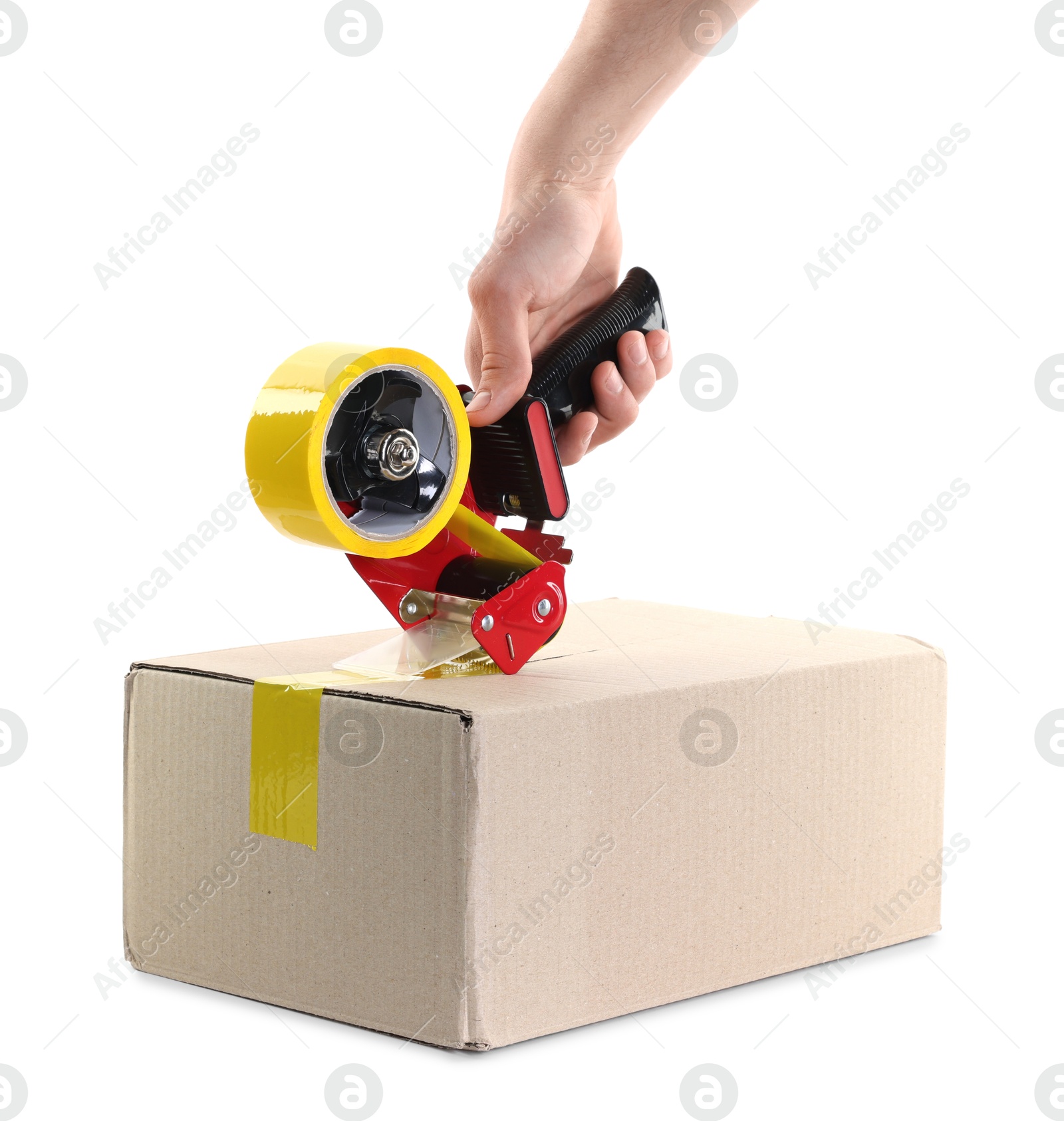 Photo of Man using dispenser with adhesive tape to seal cardboard box on white background, closeup