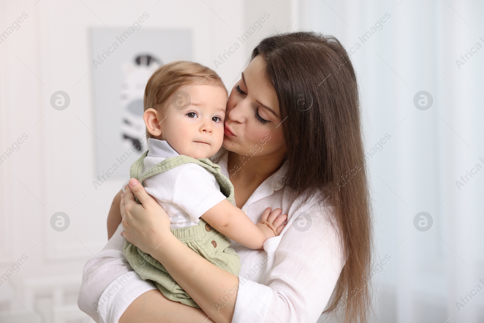 Mother with her cute little baby at home Photo of Mother with her cute little baby at home