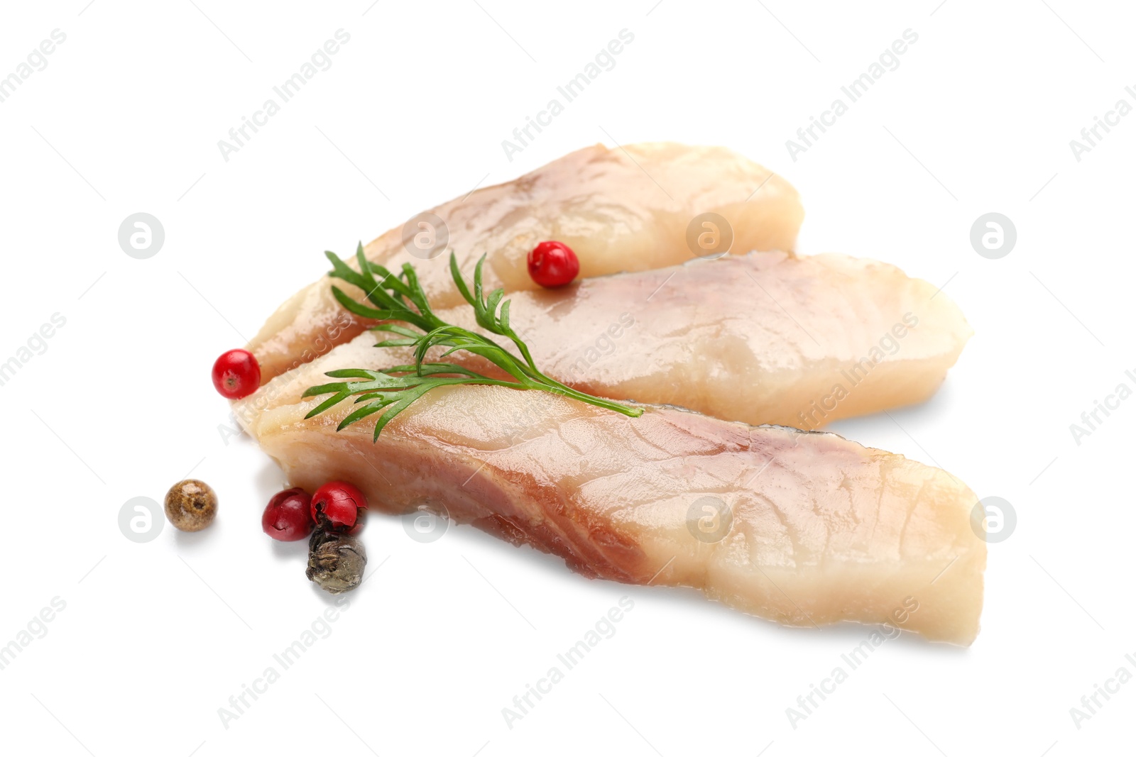 Pieces of delicious herring with peppercorns and dill isolated on white Photo of Pieces of delicious herring with peppercorns and dill isolated on white