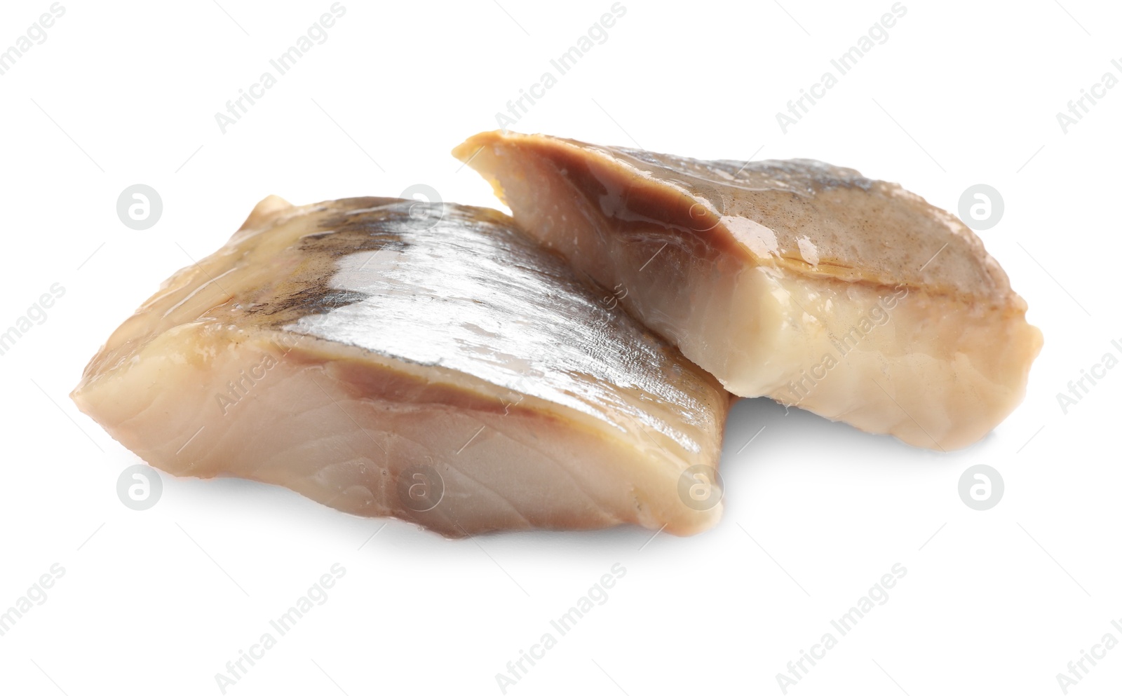 Pieces of delicious herring isolated on white Photo of Pieces of delicious herring isolated on white