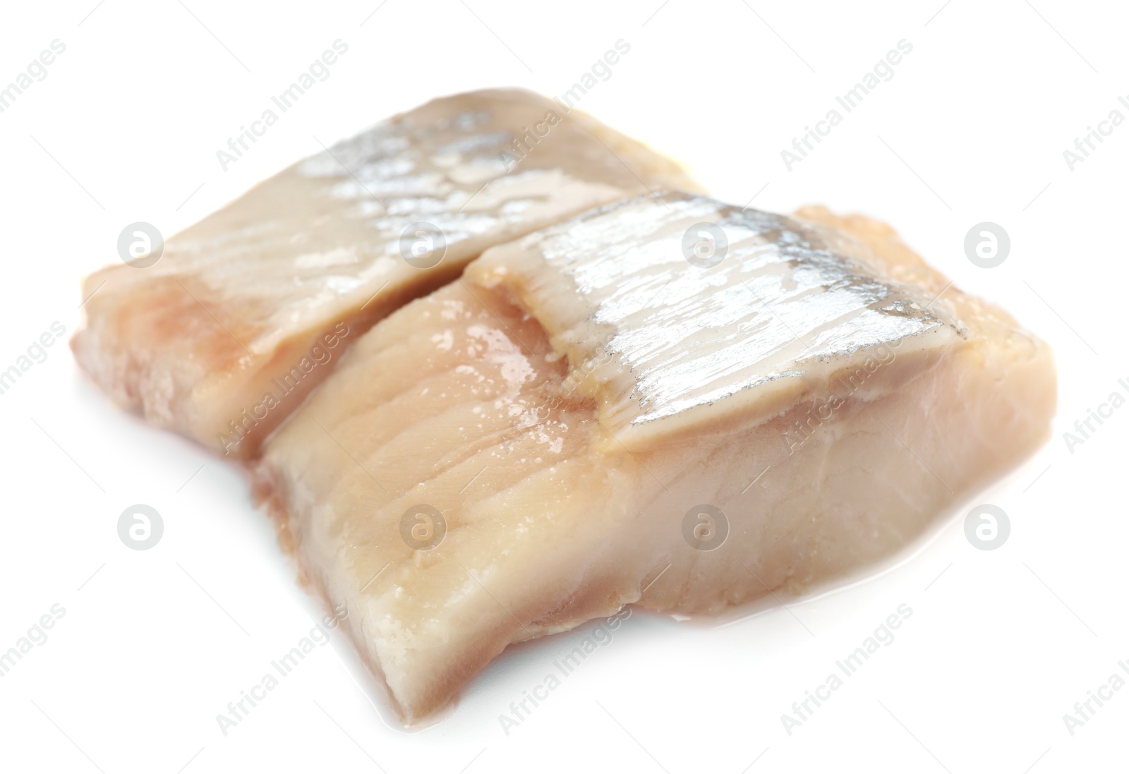 Pieces of delicious herring isolated on white Photo of Pieces of delicious herring isolated on white