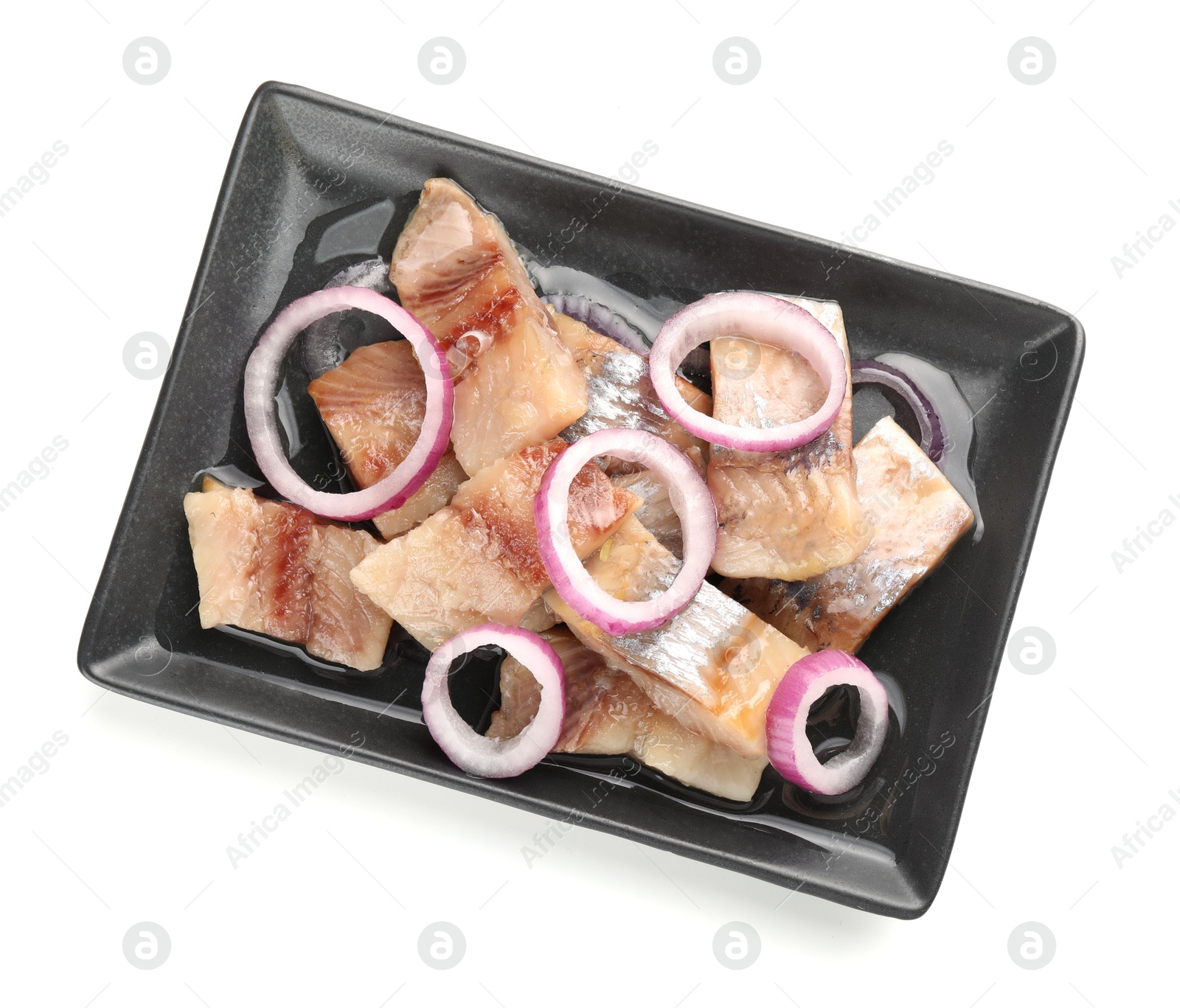 Pieces of delicious herring with onions isolated on white, top view Photo of Pieces of delicious herring with onions isolated on white, top view