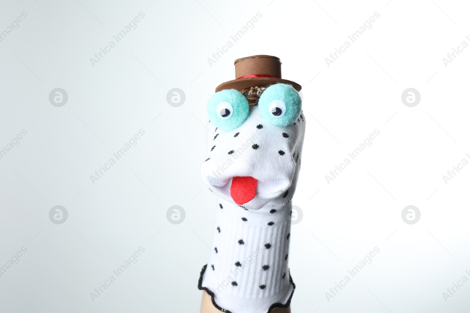 Cute sock puppet for show on hand against white background Photo of Cute sock puppet for show on hand against white background