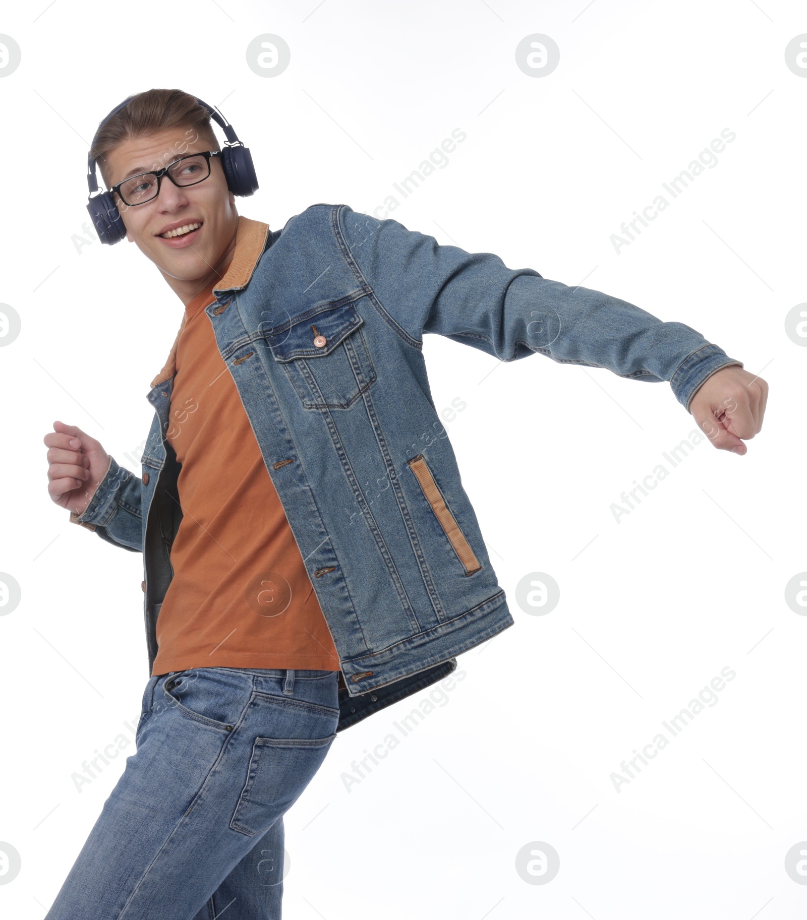 Photo of Happy man in headphones dancing on white background