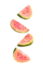 Image of Fresh guavas. Pieces of fruits falling on white background
