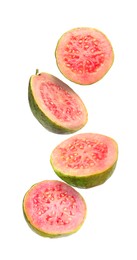 Image of Fresh guavas. Pieces of fruits falling on white background