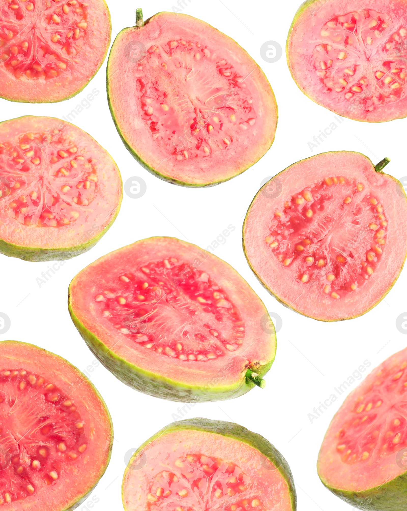 Fresh guavas. Pieces of fruits falling on white background Image of Fresh guavas. Pieces of fruits falling on white background