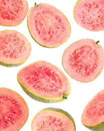 Image of Fresh guavas. Pieces of fruits falling on white background
