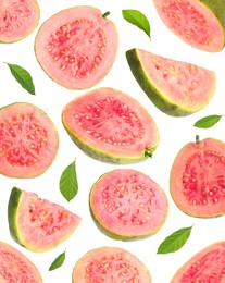 Image of Fresh guavas. Pieces of fruits and leaves flying on white background