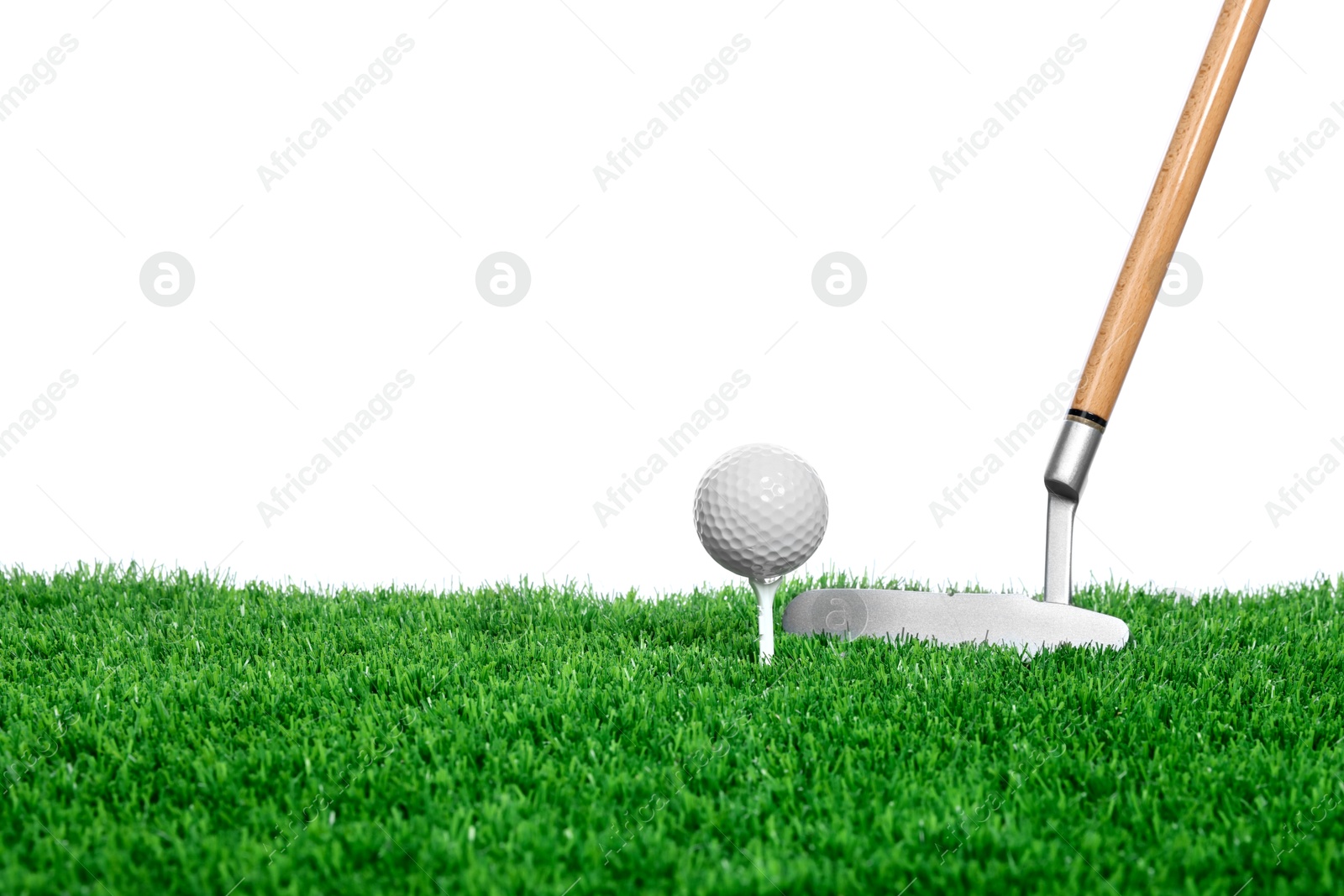 Golf ball, tee, club and green grass against white background. Space for text Photo of Golf ball, tee, club and green grass against white background. Space for text