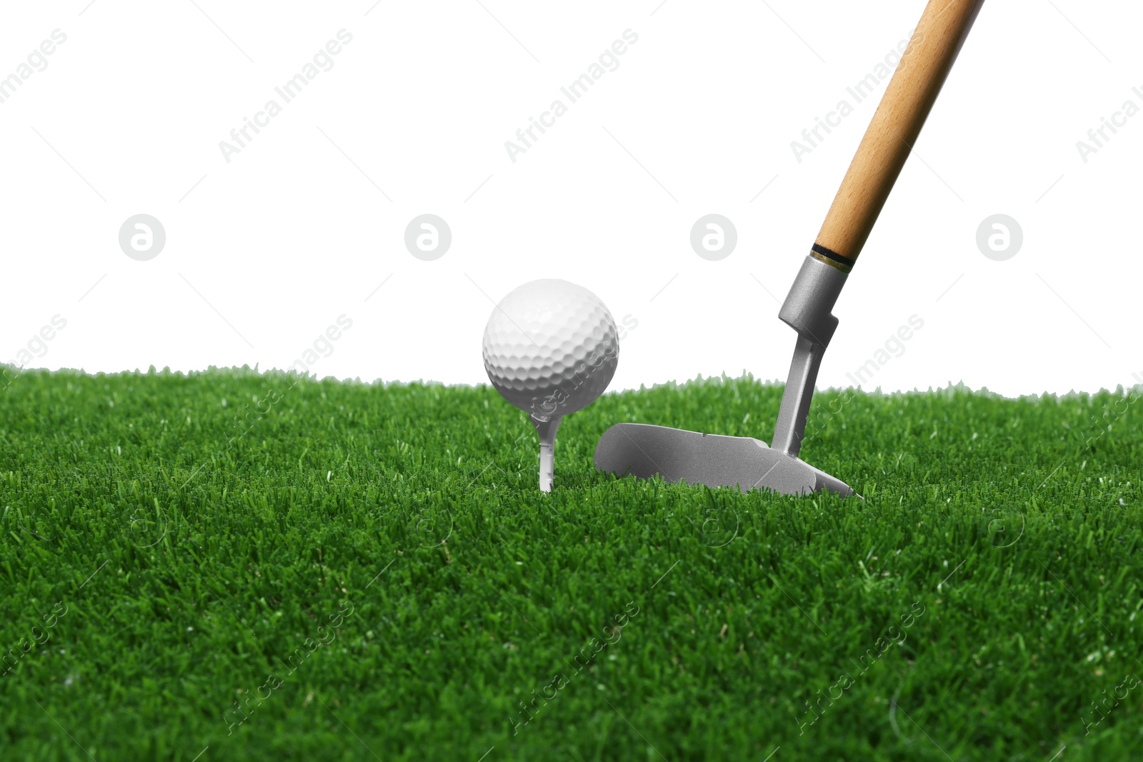 Photo of Golf ball, tee, club and green grass against white background
