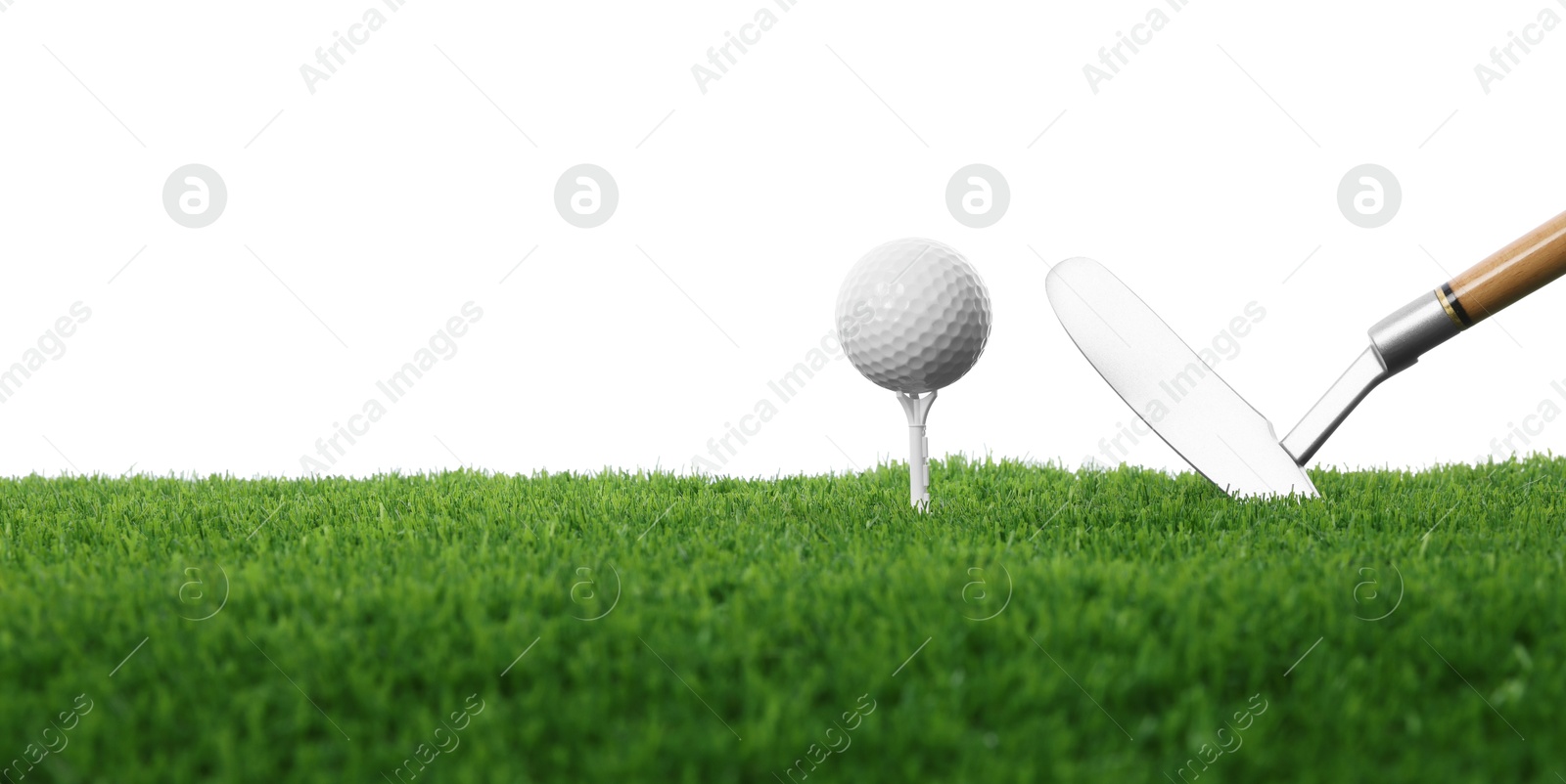 Golf ball, tee, club and green grass against white background. Space for text Photo of Golf ball, tee, club and green grass against white background. Space for text