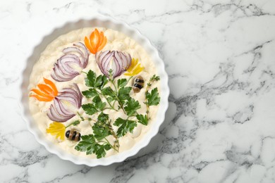 Photo of Raw focaccia with vegetables and olives in baking dish on white marble table, top view. Space for text