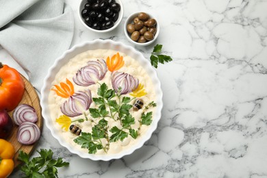Photo of Raw focaccia with vegetables and olives on white marble table, flat lay. Space for text