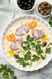 Photo of Raw focaccia with vegetables and olives on white marble table, flat lay