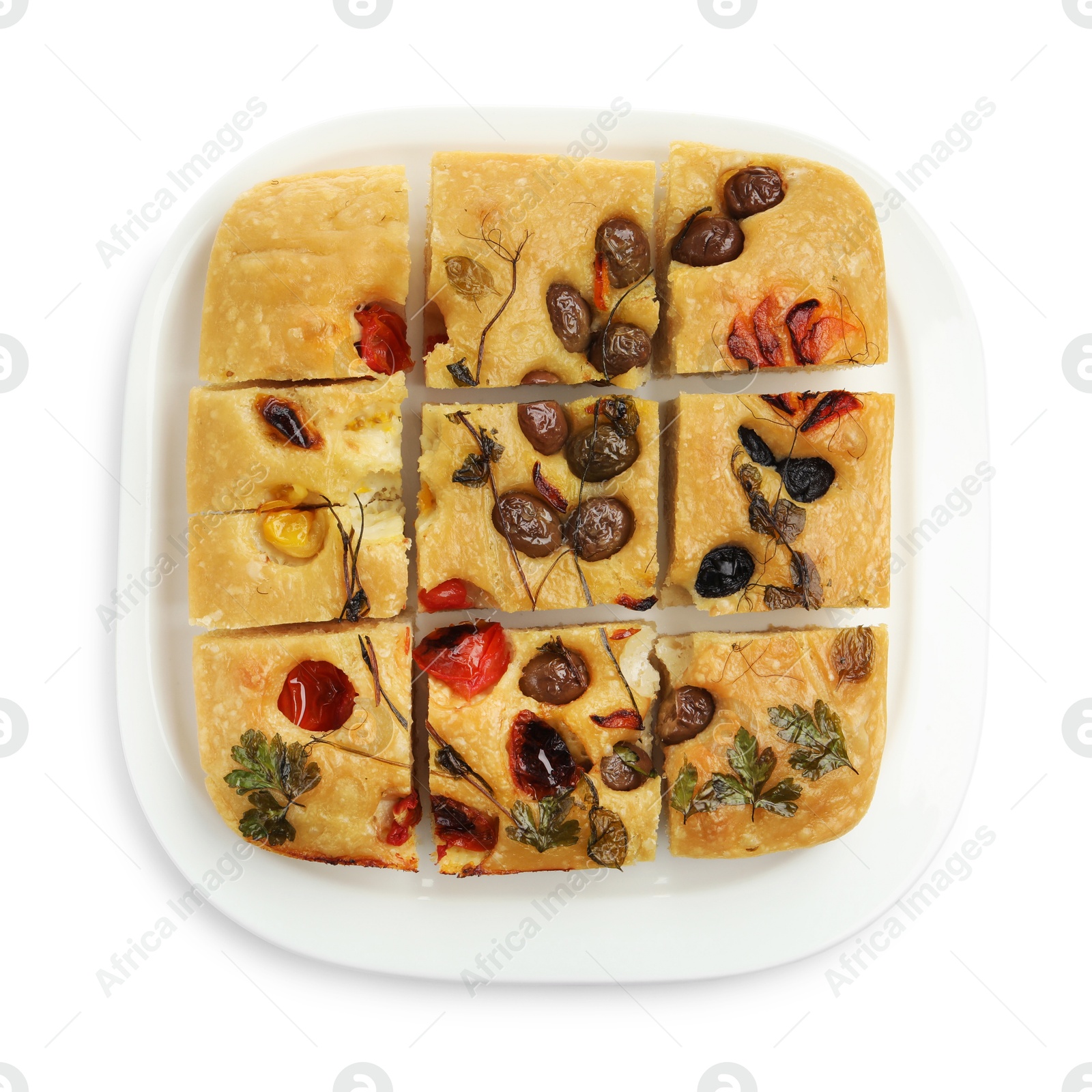 Cut delicious focaccia with flowers made of vegetables isolated on white, top view Photo of Cut delicious focaccia with flowers made of vegetables isolated on white, top view