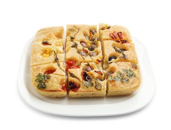 Photo of Cut delicious focaccia with flowers made of vegetables isolated on white
