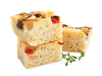 Photo of Pieces of delicious focaccia isolated on white