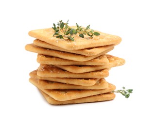 Photo of Tasty salty crackers with thyme isolated on white