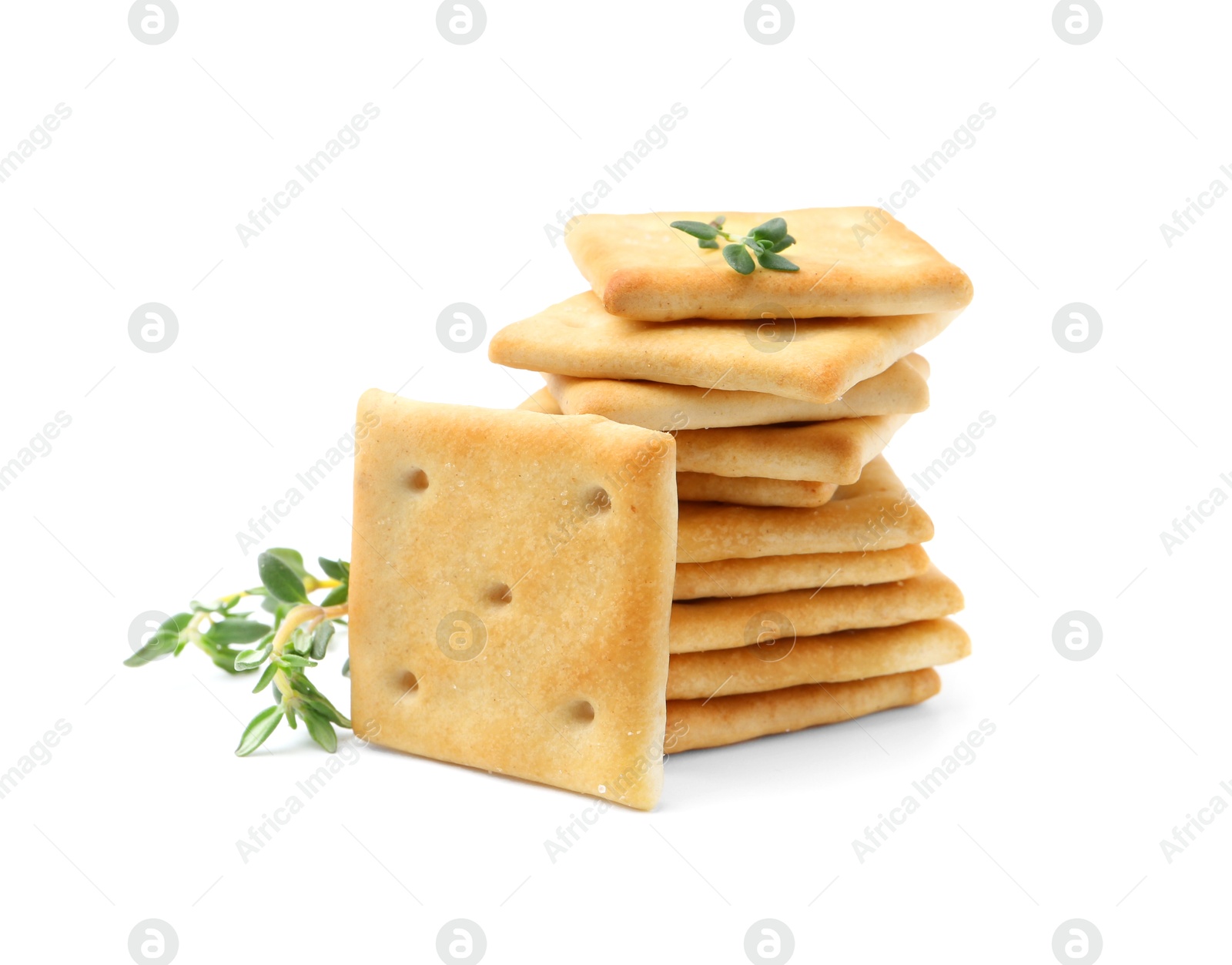 Photo of Tasty salty crackers with thyme isolated on white