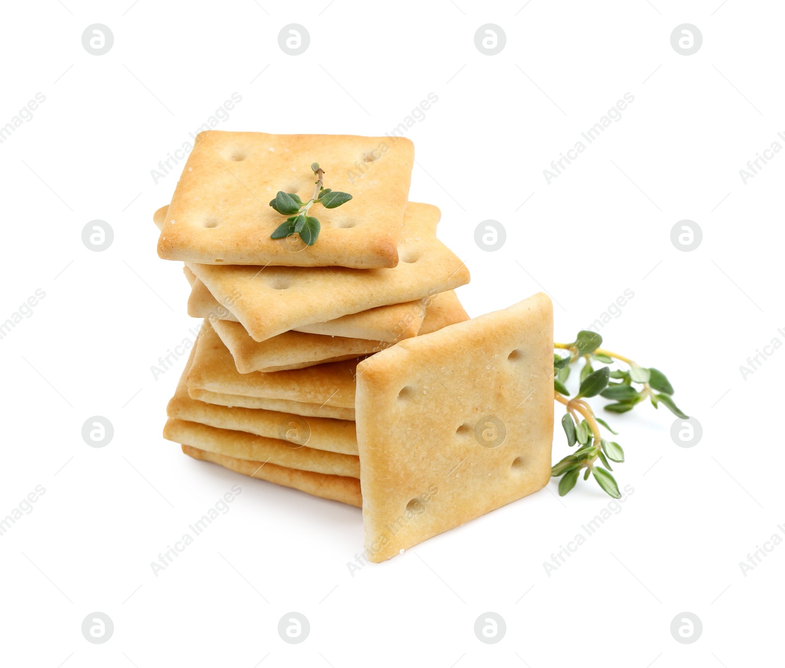 Tasty salty crackers with thyme isolated on white Photo of Tasty salty crackers with thyme isolated on white