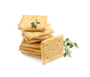 Photo of Tasty salty crackers with thyme isolated on white