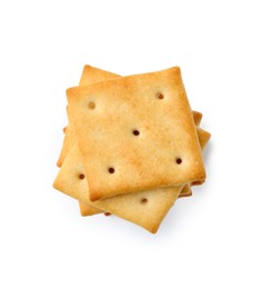 Photo of Tasty salty crackers isolated on white, top view