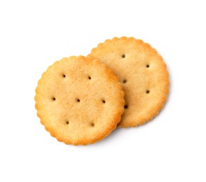 Photo of Tasty salty crackers isolated on white, top view