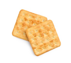 Photo of Tasty salty crackers isolated on white, top view