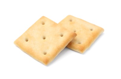 Photo of Two tasty salty crackers isolated on white