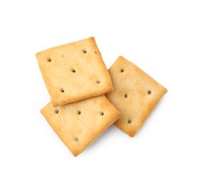 Photo of Tasty salty crackers isolated on white, top view