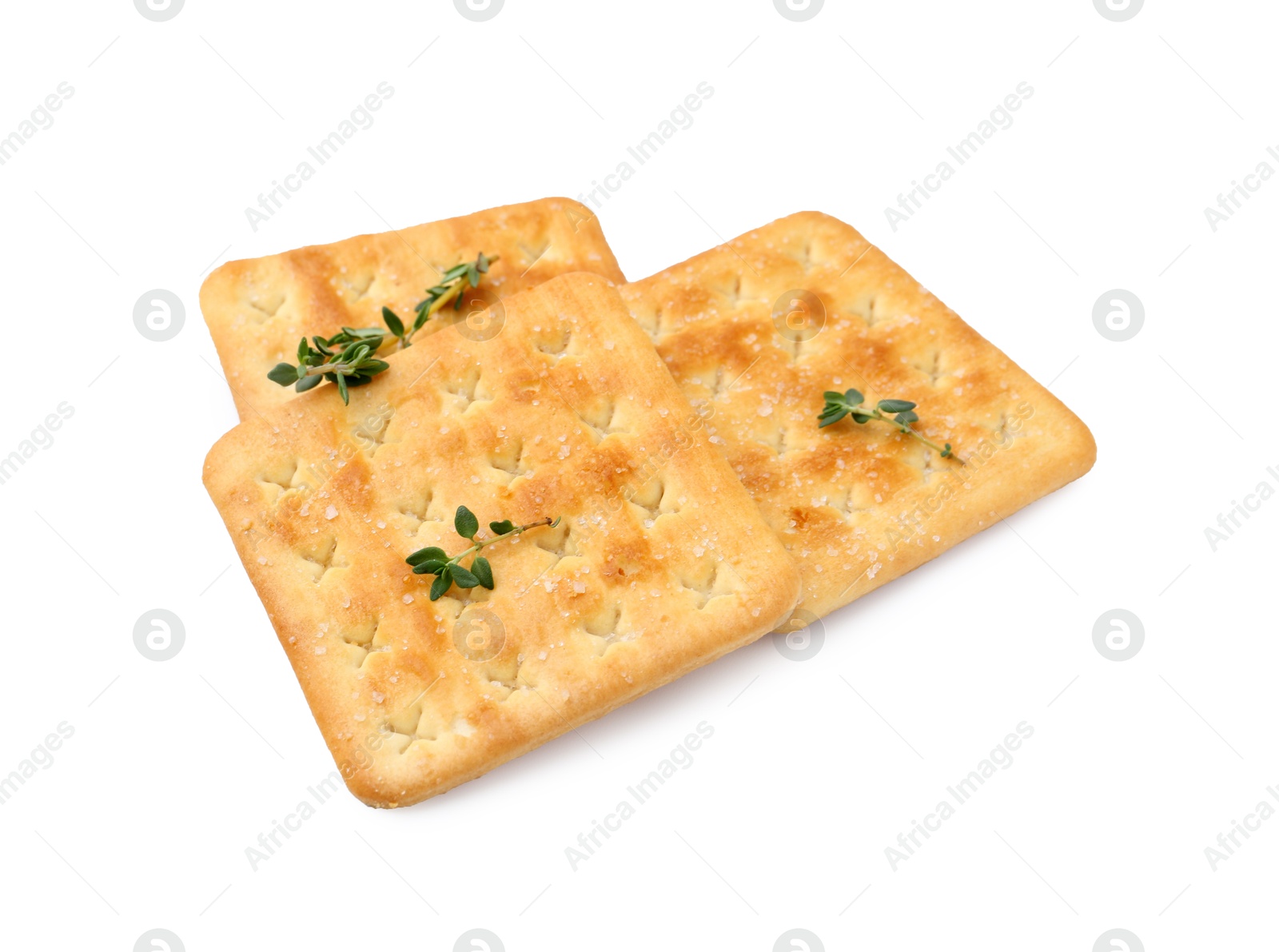 Tasty salty crackers with thyme isolated on white Photo of Tasty salty crackers with thyme isolated on white