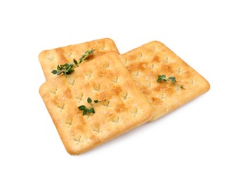 Photo of Tasty salty crackers with thyme isolated on white