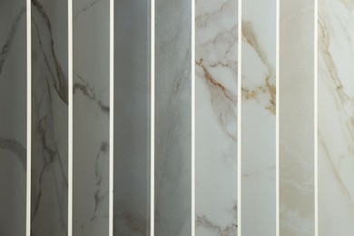 Photo of Many different samples of tiles as background, closeup