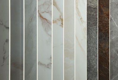 Photo of Many different samples of tiles as background, closeup