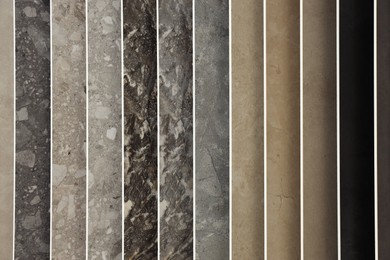 Photo of Many different samples of tiles as background, closeup