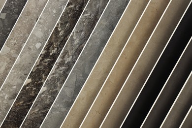 Photo of Many different samples of tiles as background, closeup