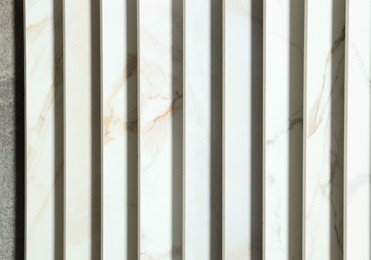 Photo of Many different samples of tiles as background, closeup