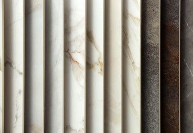 Photo of Many different samples of tiles as background, closeup