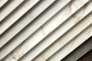 Photo of Many different samples of tiles as background, closeup