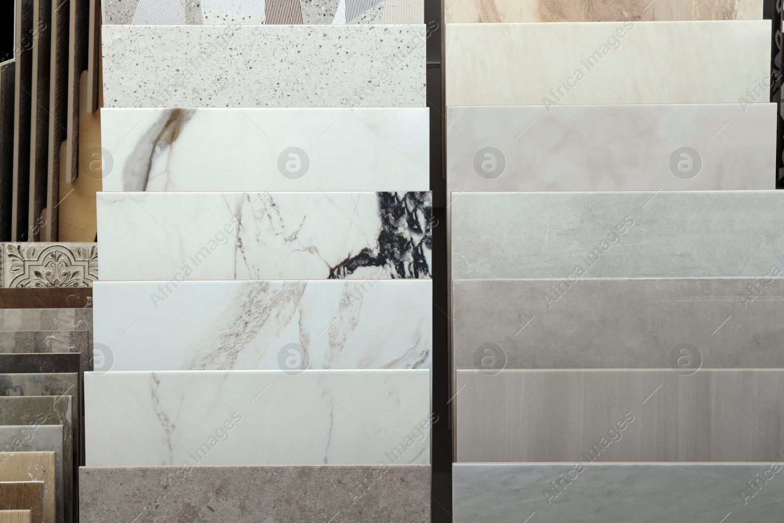 Many different samples of tiles on display in store Photo of Many different samples of tiles on display in store