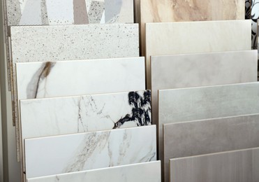 Photo of Many different samples of tiles on display in store